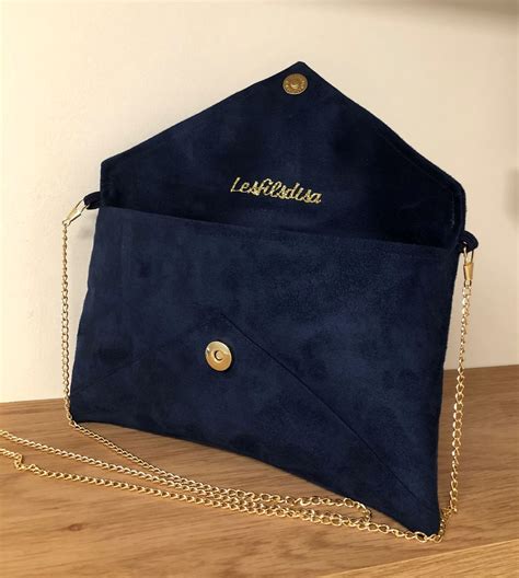 navy blue suede clutch bag.